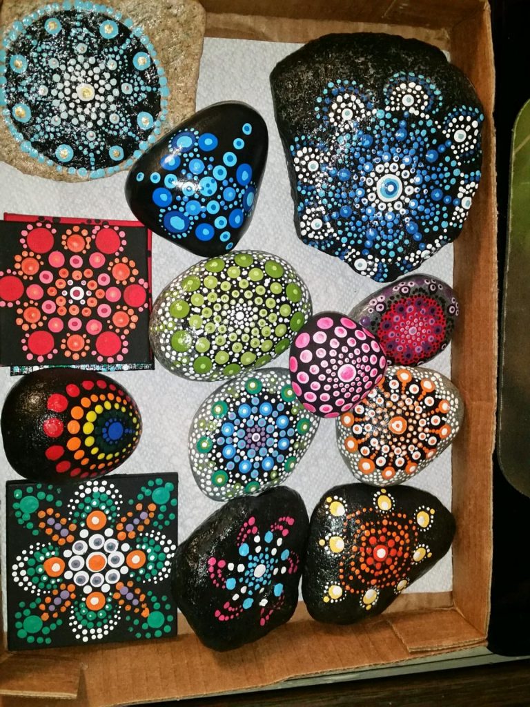 Mandala painting on a smooth river rocks