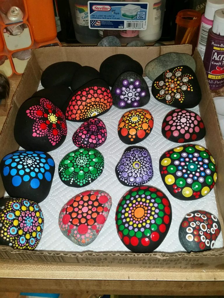Mandala painting on a smooth river rocks